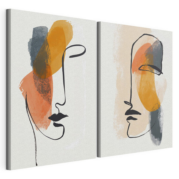 Two faces drawn on paper