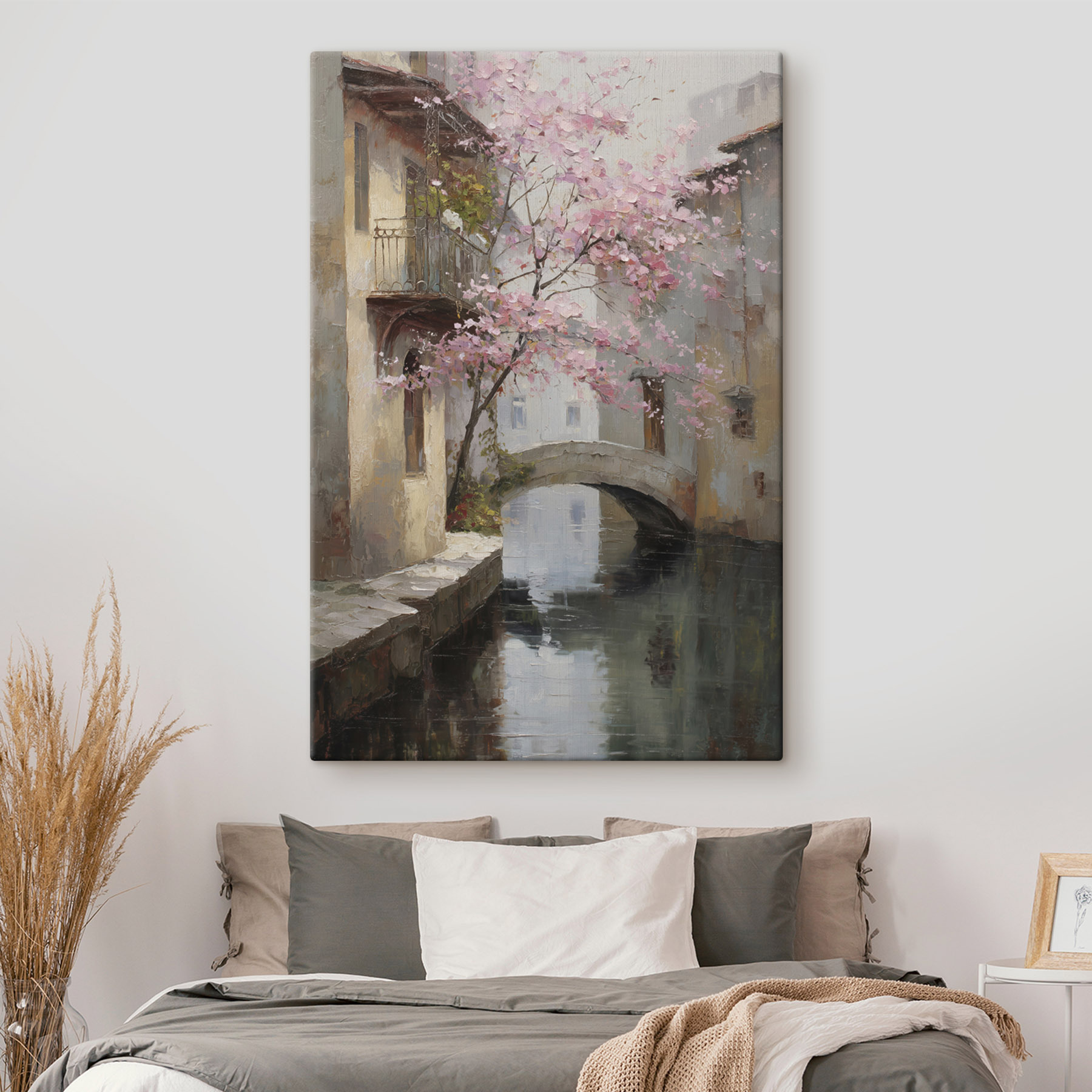 Painting of a river with a pink tree and a bridge