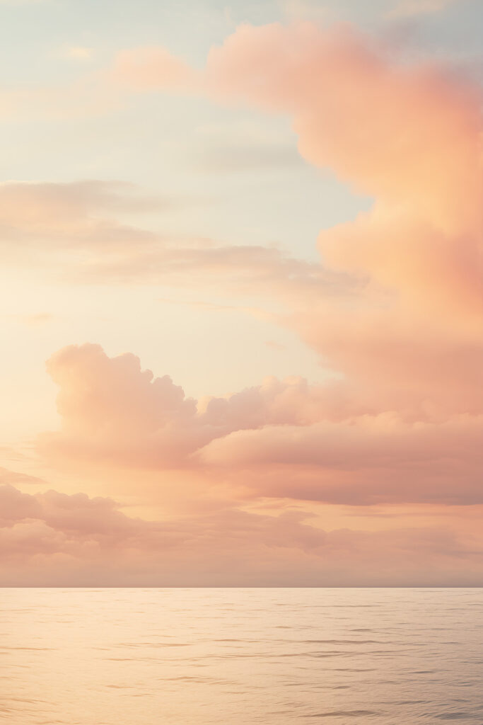 Body of water with clouds in the sky
